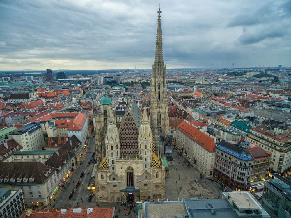 Vienna, Austria -  St. Stephen's Cathedral in Vienna, Austria. Roof and Cityscape in Background.