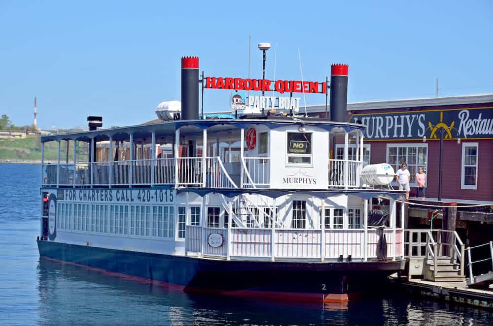 Harbour Queen I is a beautiful two-level Mississippi-style sternwheeler. The lower deck is enclosed and heated while the upper deck is roofed and open to the air.