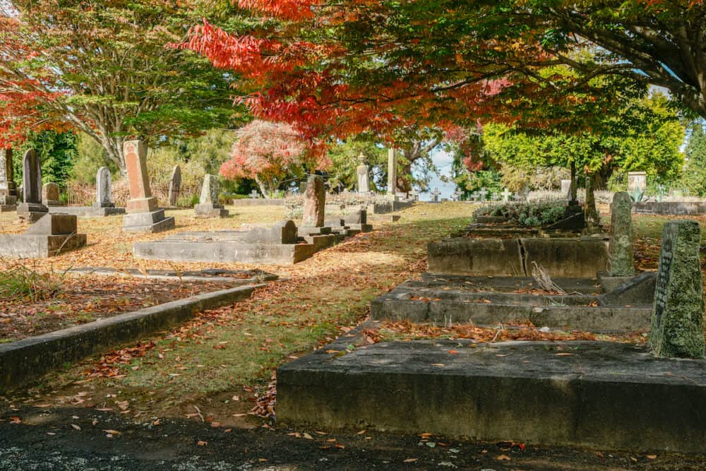 Hamilton New Zealand - Old graveyard with headstones under trees