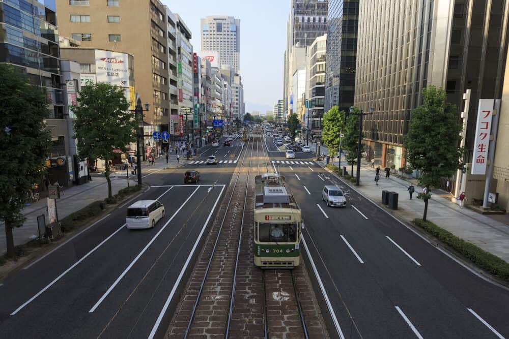 Hiroshima, Japan - A Hiroshima streetcar (Hiroden) run-pass, through Hondori Street.