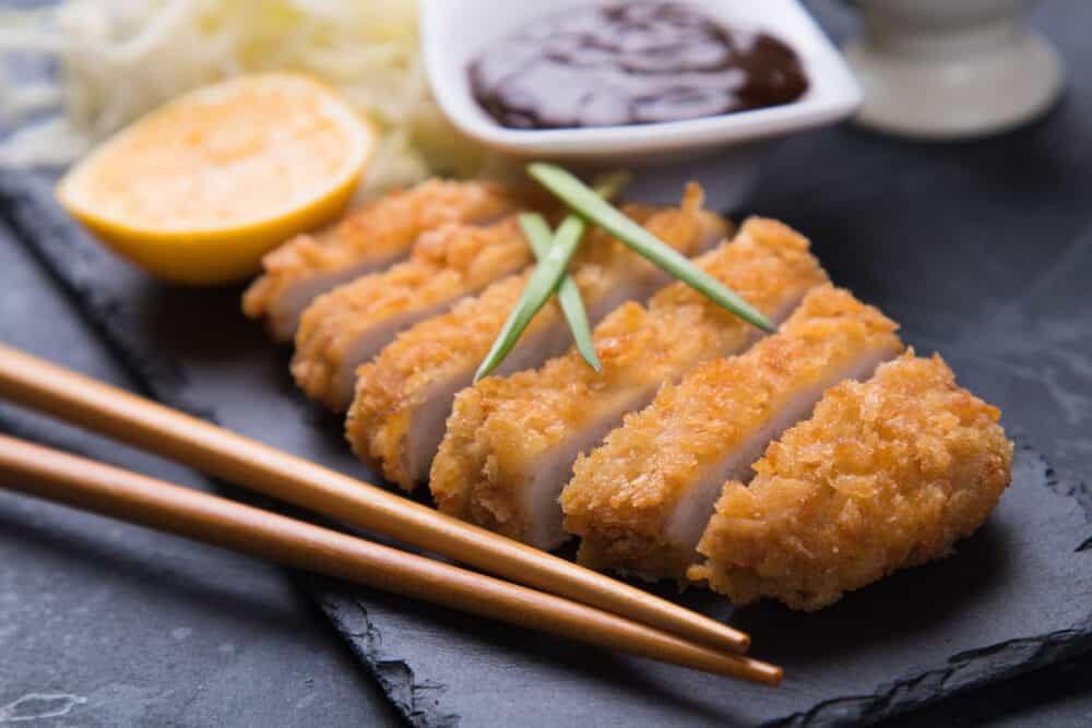 Japanese tonkatsu steak, breaded and fried pork cutlet served with shredded cabbage