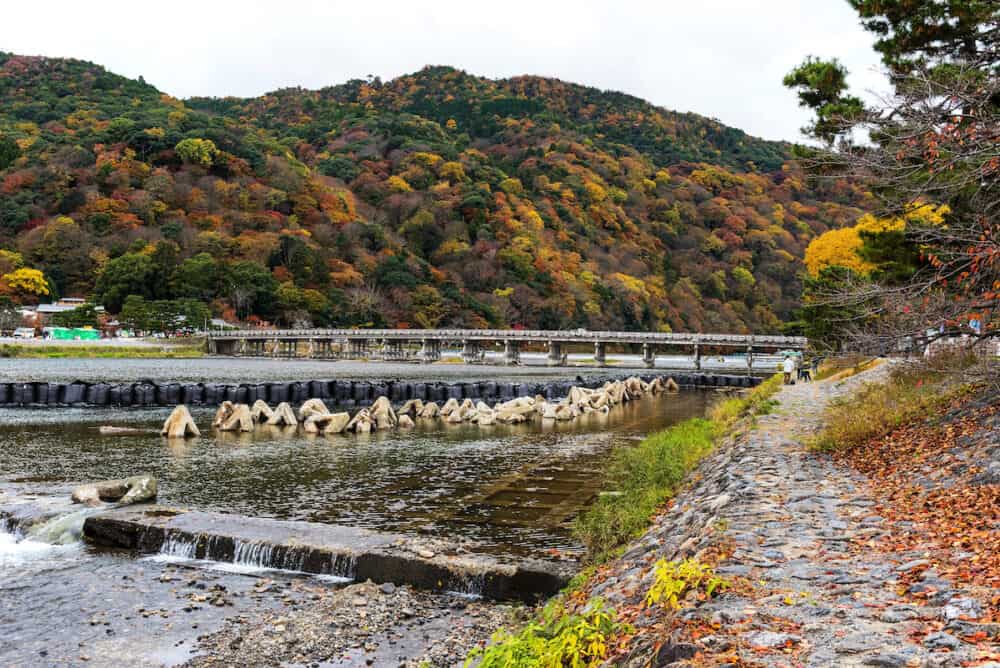 Togetsukyo bridge over Katsura river with autumn foliage color in Arashiyama Kyoto Japan