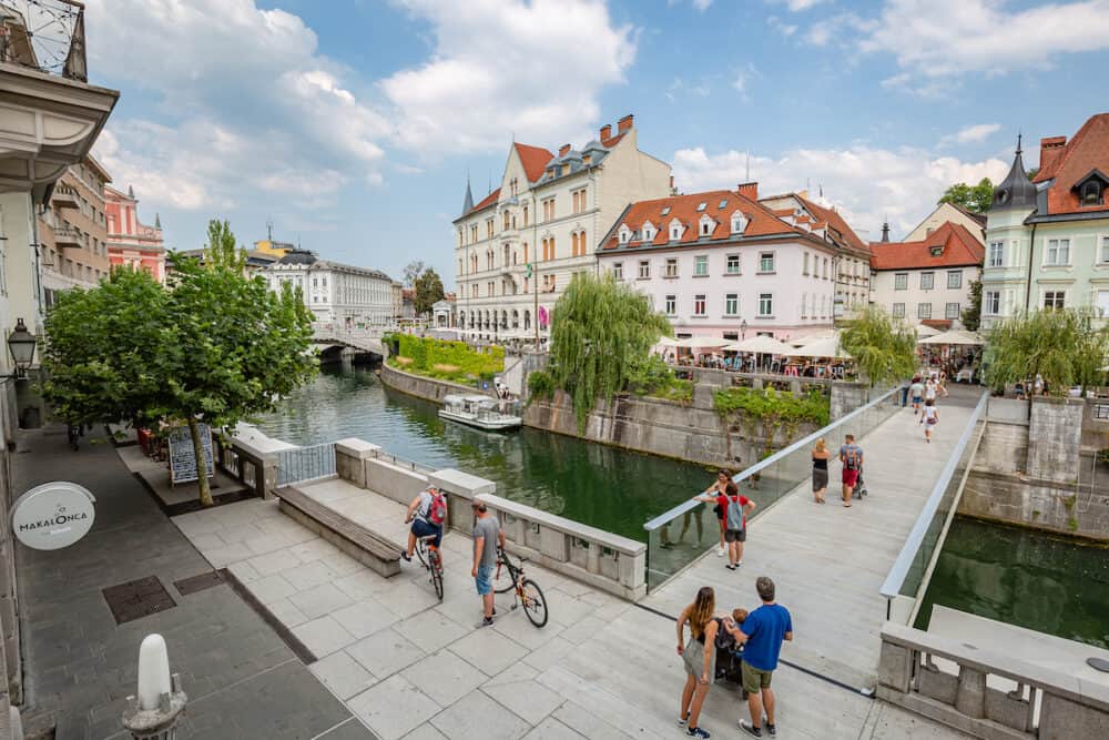 Ljubljana, Slovenia - cityscape. Walking near bank of river in the historical center of Ljubljana, Slovenia