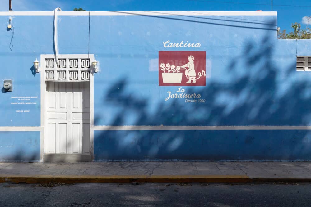 Merica, Yucatan, Mexico - Colonial blue building with typical cantina painted text