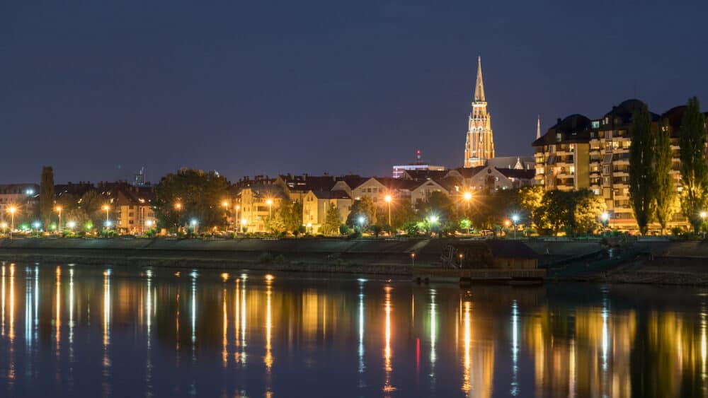 River Drva coast reflection by night in city Osijek, Croatia