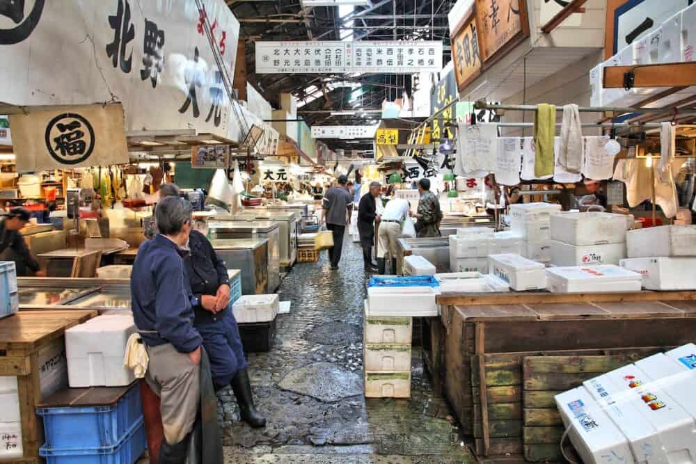 TOKYO JAPAN - Merchants sell seafood at Tsukiji Fish Market in Tokyo. It is the biggest wholesale fish and seafood market in the world.