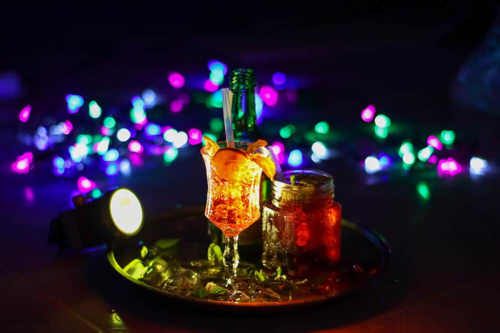 Make cocktail drinks during the holidays and bokeh background