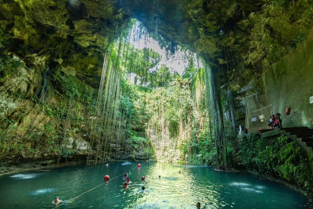 Yucatan, Mexico - People swimming ni Ik Kil Cenote Yucatan Mexico North America