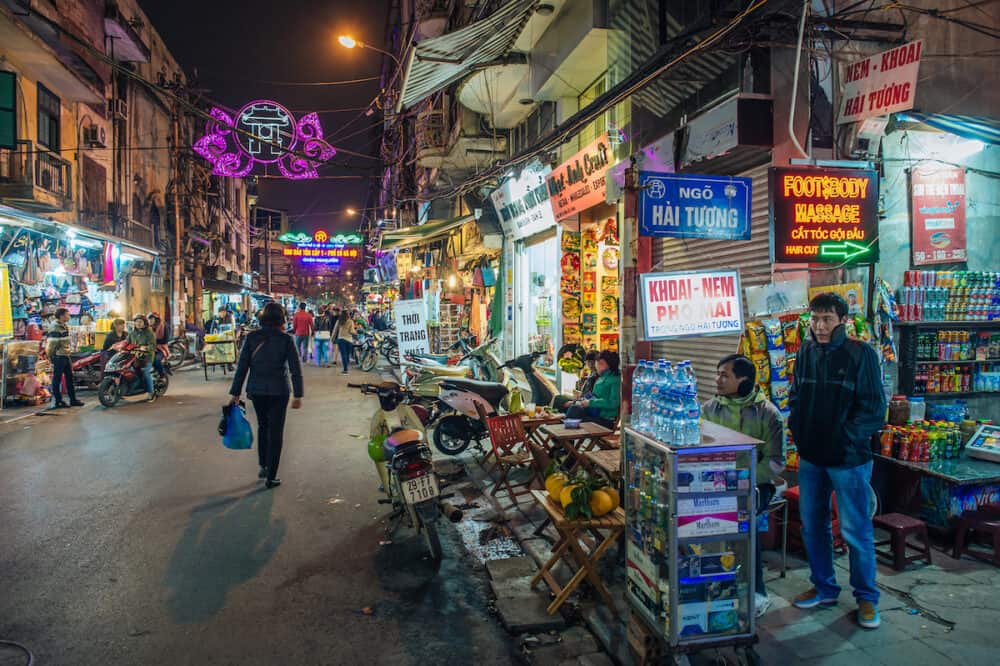 HANOI, VIETNAM -  Street scene on a chilly night in the old quarter on February 11, 2015 in Hanoi. The 36 old streets and guilds of the old quarter are a major tourist attraction.