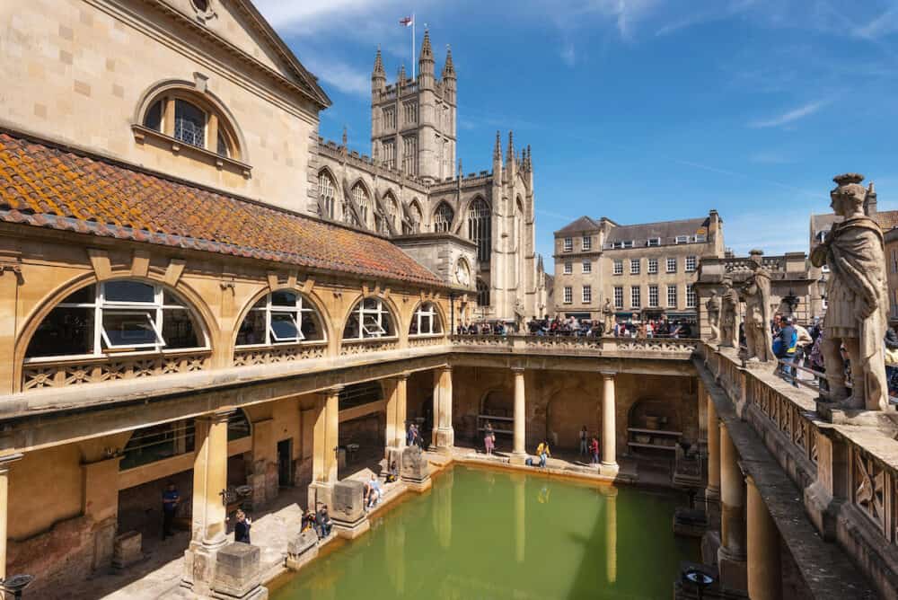 inside of Roman Baths which is a site of historical interest in the city of Bath. The landmark is a well-preserved Roman site for public bathing .
