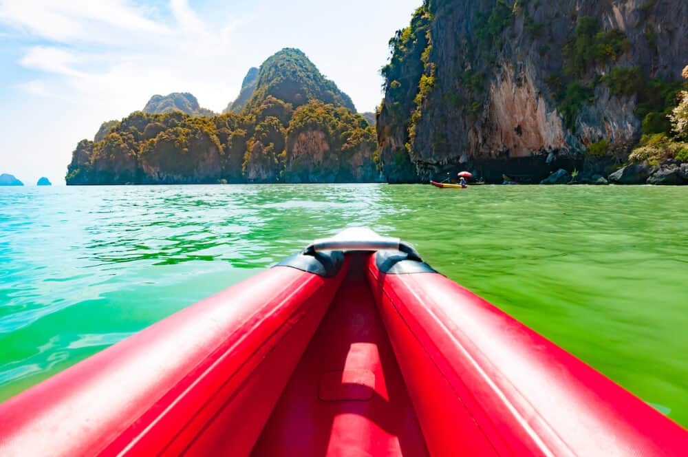 Canoeing in Phang nga bay along the large limestone rock Thailand