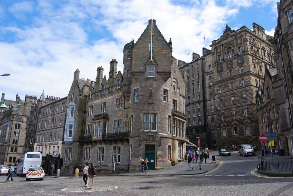 Edinburgh, United Kingdom - Market Street in Edinburg, with historic buildings, cars and people