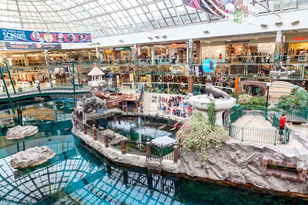 EDMONTON, CANADA -  Shoppers visit the West Edmonton Mall. At 5300000 sq ft it is the largest shopping mall in North America and 10th largest in the world.