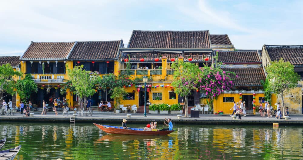 Hoi An, Vietnam - Old buildings with the river in Hoi An, Vietnam. The historic old town of Hoi An is UNESCO World Heritage Site since 1999.