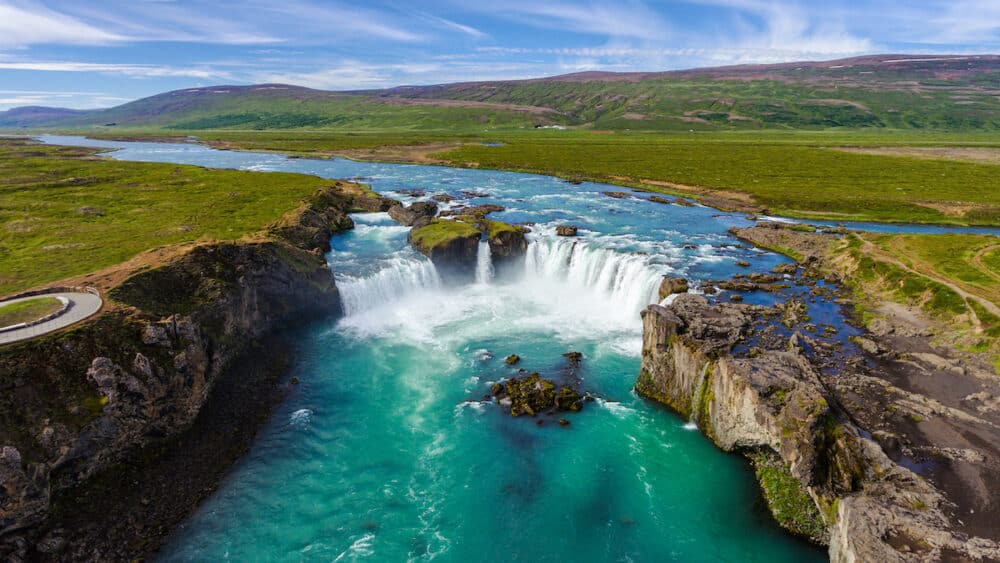 Aerial view landscape of the Godafoss famous waterfall in Iceland. The breathtaking landscape of Godafoss waterfall attracts tourist to visit the Northeastern Region of Iceland.