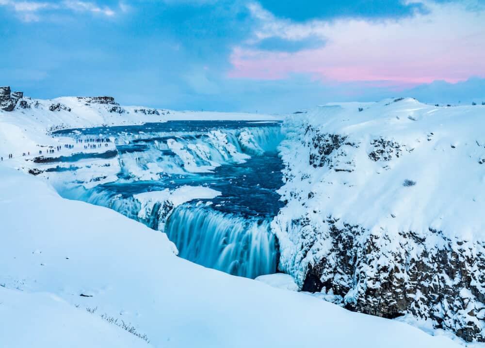 Gulfoss Waterfall of the Golden Circle in heavy snow in Iceland at sunset