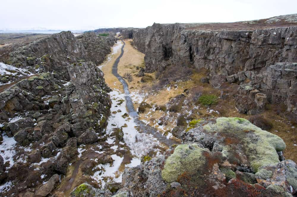 Path through the pingvellir valley in Iceland. The valley lies between the North American and Mid European tectonic plates.