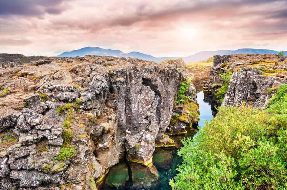 Cliffs and deep fissure in Thingvellir National Park southern Iceland