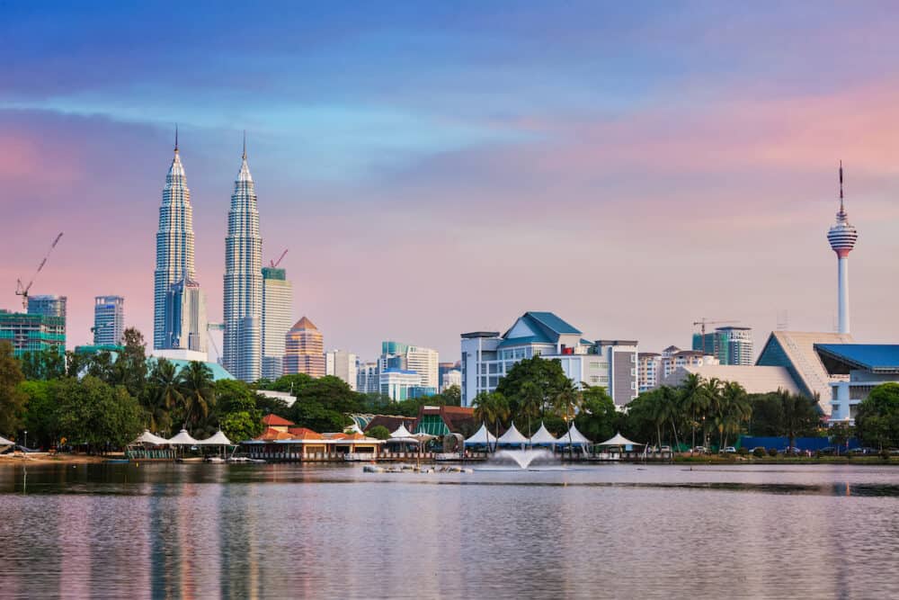 KUALA LUMPUR, MALAYSIA - Kuala Lumpur skyline with Petronas Twin Towers skyscrapers on sunset. View over Titiwangsa Lake. Kuala Lumpur, Malaysia