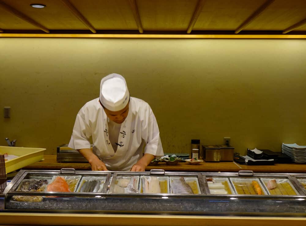  Sushi cook working at traditional restaurant in Nagoya, Japan.