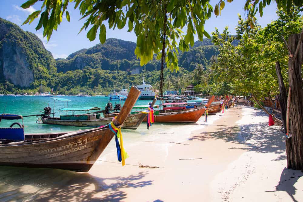 Phi Phi Island, Phuket / Thailand -Longtail boats line the shore in Maya Bay at Phi Phi island