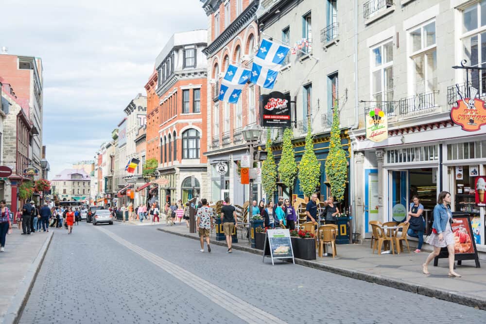 QUEBEC CITY,CANADA-people and tourists stroll through the quaint streets of Quebec City during a summer morning. Here we are on Rue Saint Jean