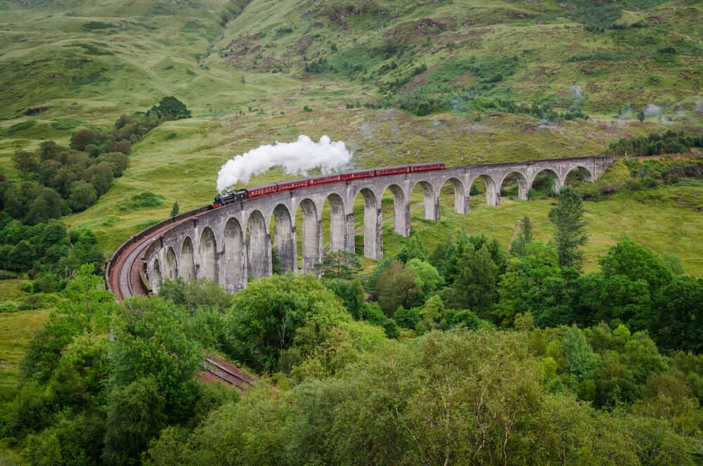 View of a steam train on a famous Glenfinnan viaduct Scotland