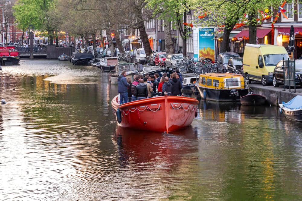 AMSTERDAM, NETHERLANDS -A group of unidentified residents hold a pleasure boat party on the urban canals.