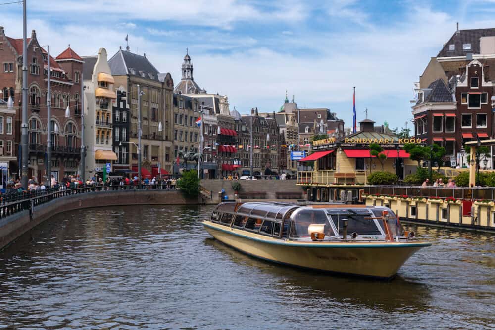 Amsterdam, The Netherlands - Tour boat in Rokin Canal