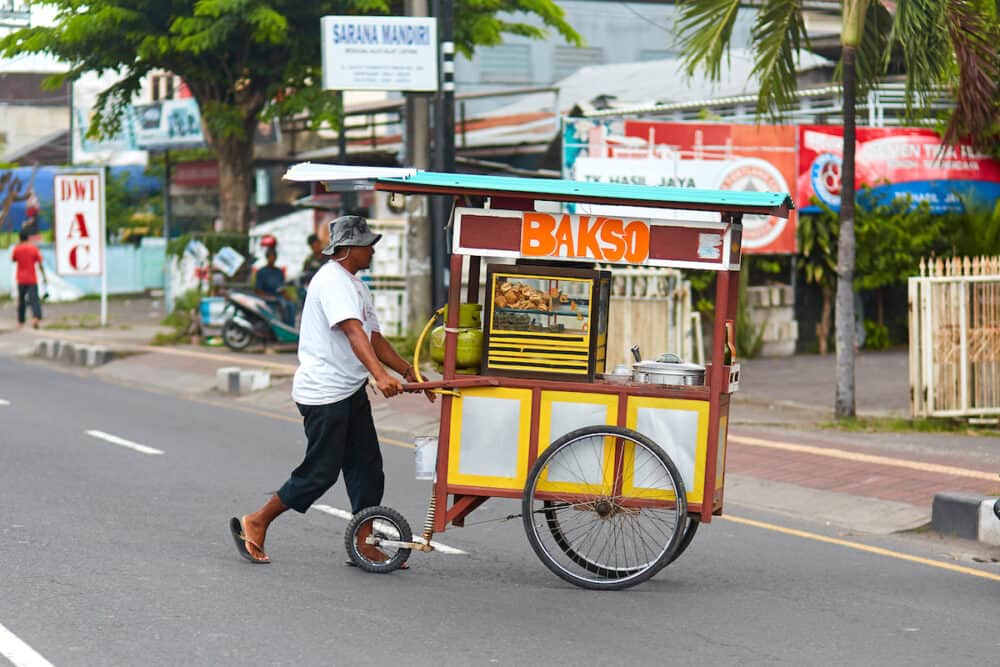 Small private businesses in Asia. Selling food from a mobile counter. Bali, Indonesia