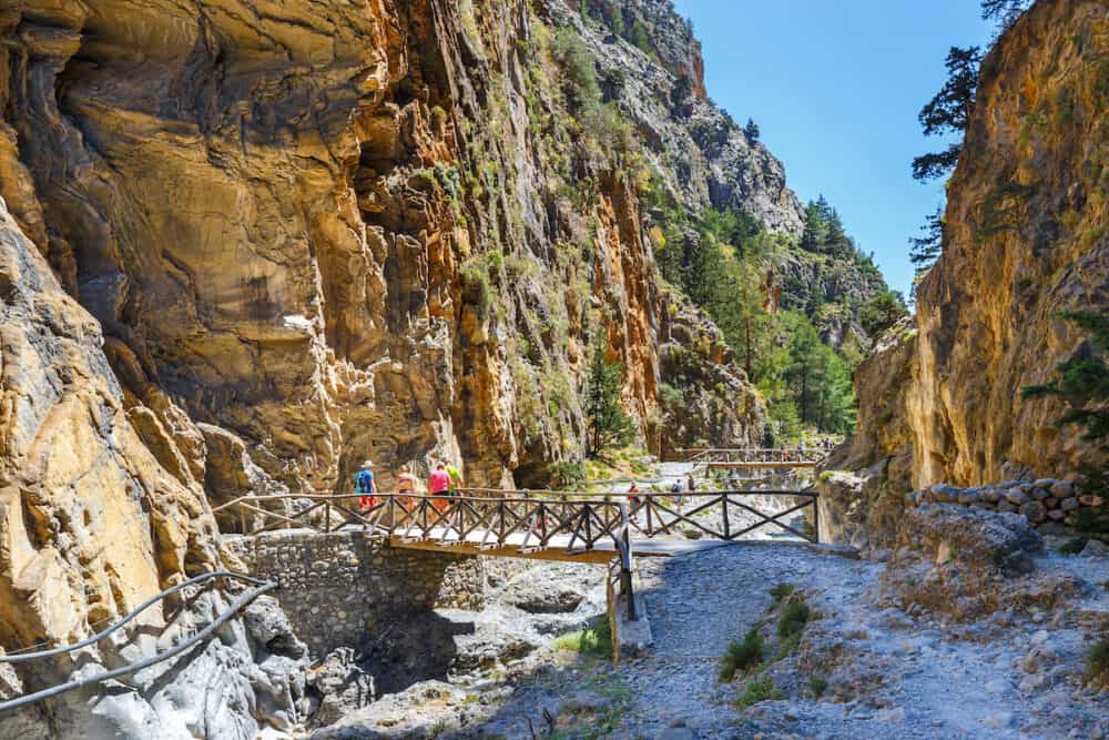 Samaria Gorge Greece - Tourists hike in Samaria Gorge in central Crete Greece. The national park is a UNESCO Biosphere Reserve since 1981