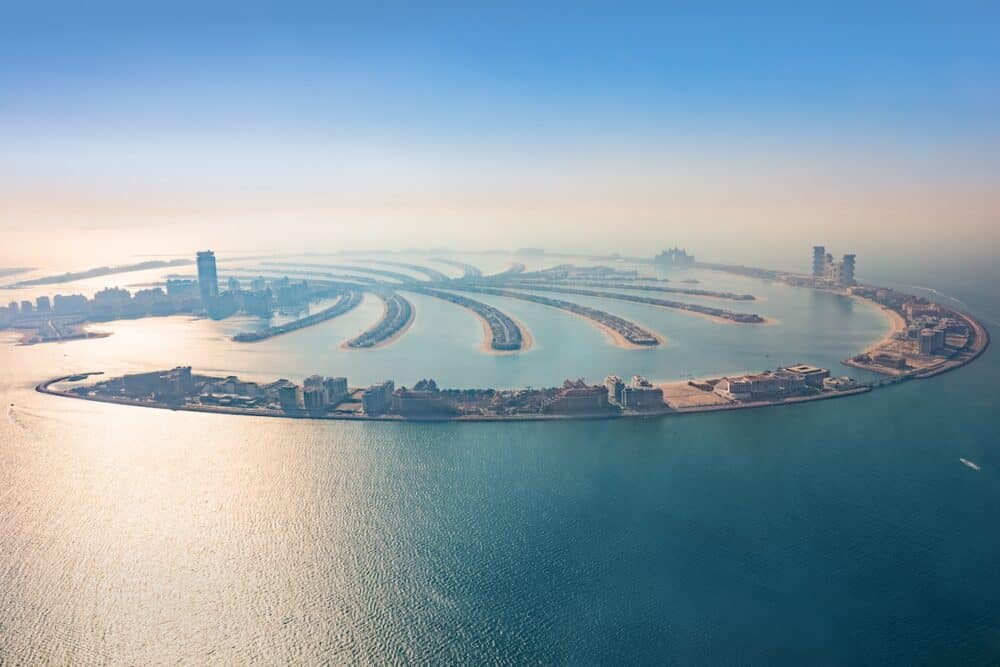 Dubai Palm Jumeirah island aerial view in United Arab Emirates. View from helicopter