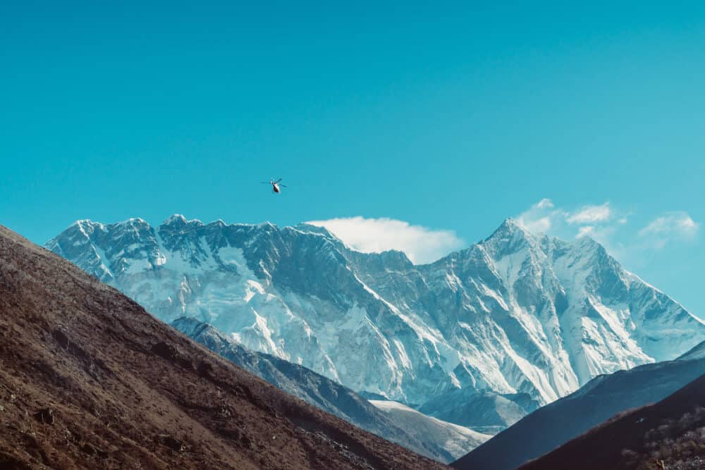 helicopter flies over the Khumbu valley, Himalaya, Nepal. Himalaya landscape and mountain views.