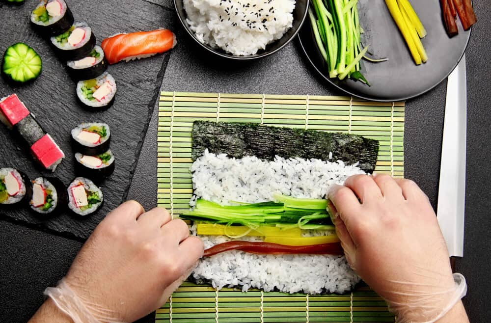The process of making sushi and rolls top view