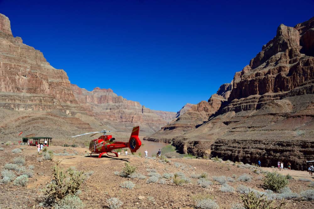 Grand Canyon, USA -  A look at red helicopters in the majestic Grand Canyon