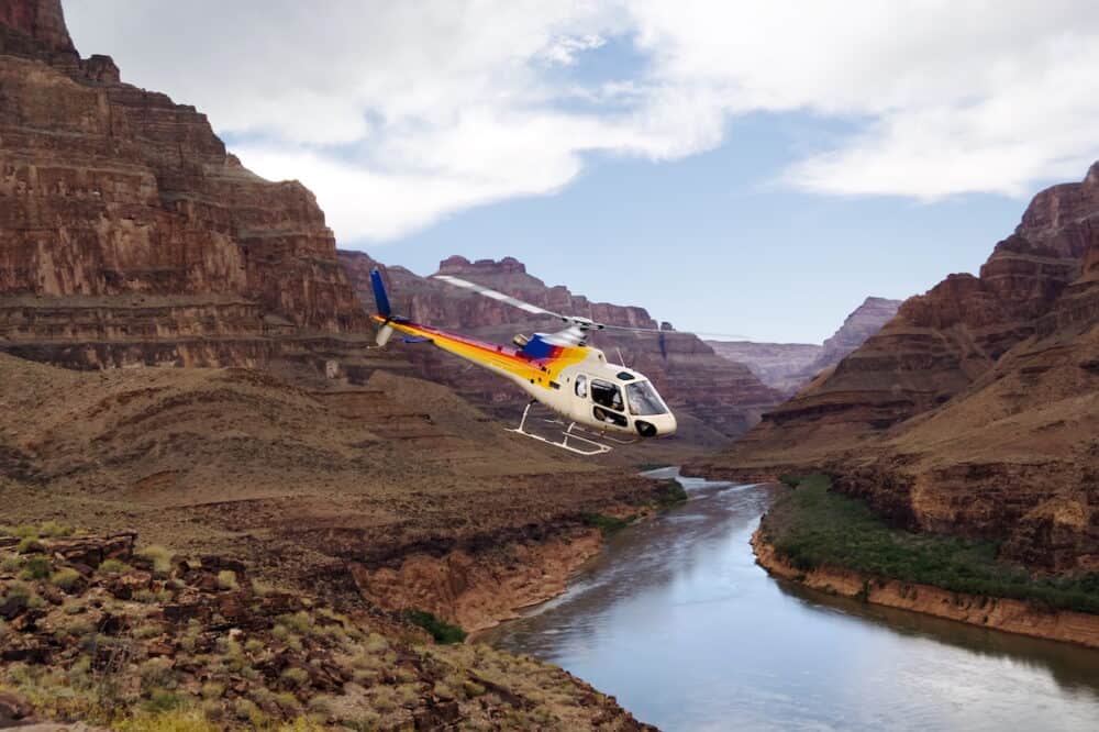 Ride of your life. Chopper flying over Grand Canyon West Rim. Colorado river Arizona USA.