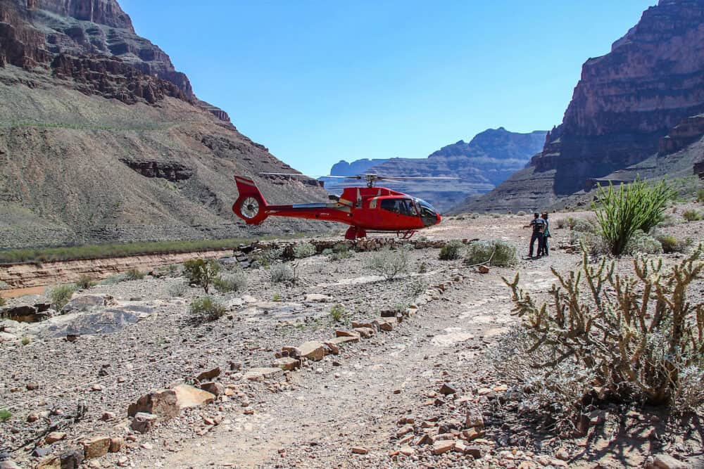 Grand Canyon West. Helicopter with tourist is taking off. Helicopter tours over Grand Canyon.
