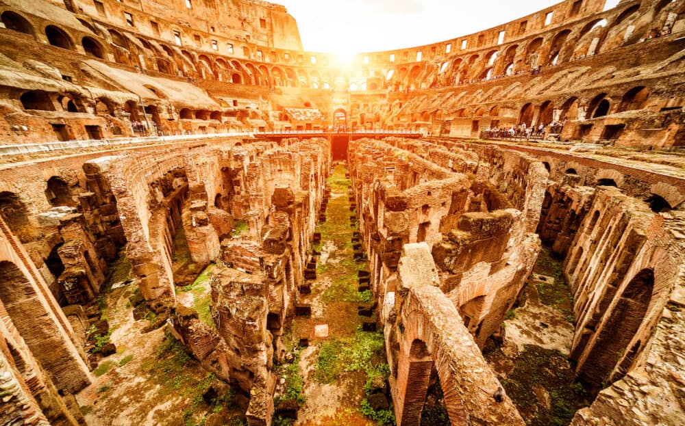 Inside the Colosseum or Coliseum in summer. Colosseum is the main travel attraction of Roma. Ruins of the Colosseum arena. Panoramic view of Colosseum in the sunlight.