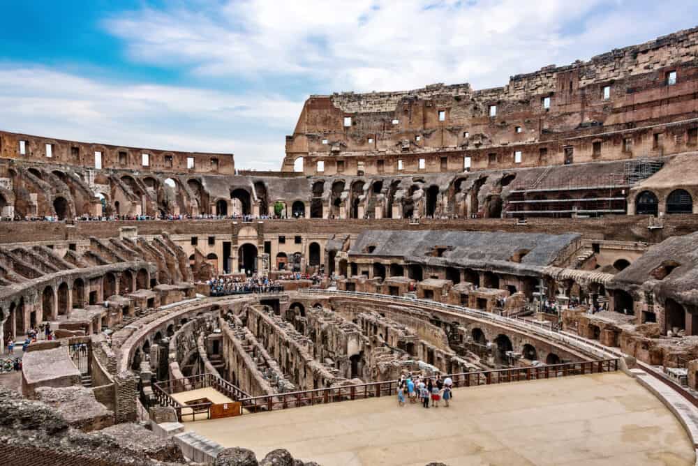 Tourists inside the Colosseum in Rome. It's an oval amphitheatre in the center of the city and was estimated to hold as many as 80000 spectators.