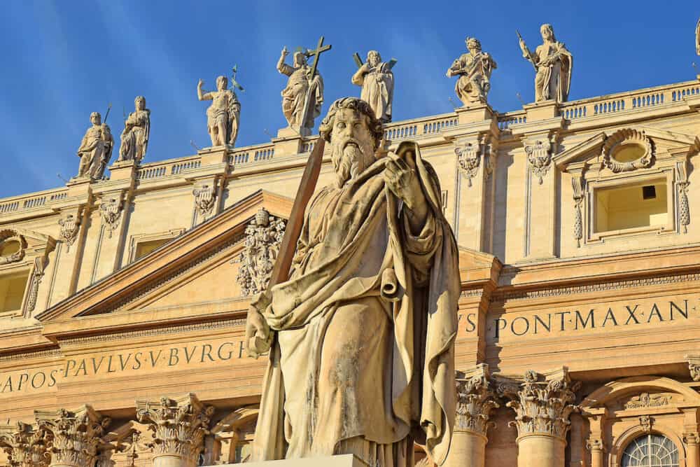statue of St. Paul with sword at the Vatican in front of St. Peter's Basilica in Rome, Italy