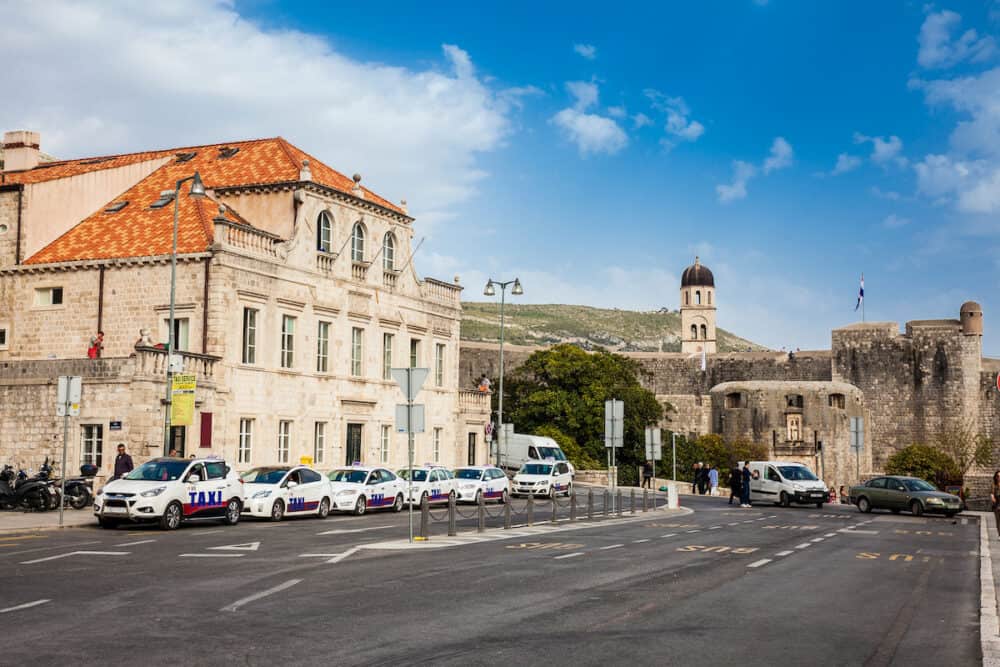 Taxis at along branitelja Dubrovnika next to the walls of the Old Town in Dubrovnik