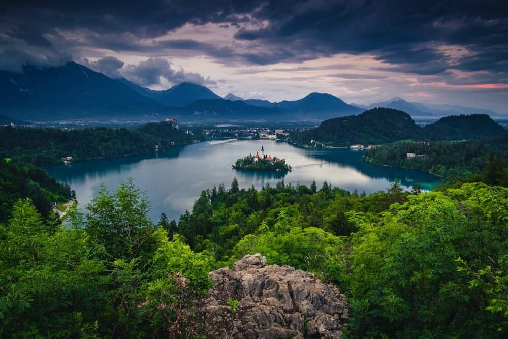 Amazing evening view with lake and church on the small island.Great travel and touristic location, lake Bled with small island and Karavanke mountains in background at sunset, Slovenia, Europe