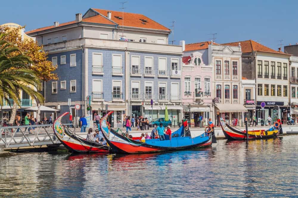 Canal with traditional colorful Moliceiro boats in Aveiro, Portugal