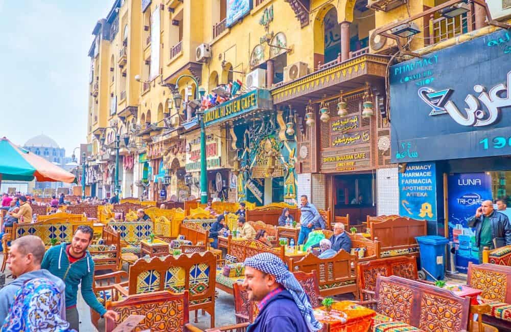 CAIRO, EGYPT - The lines of traditional restaurants with colorful carved wooden sofas on Midan Hussein Square in Cairo.