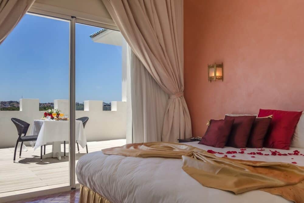 Luxury hotel room with breakfast on terrace