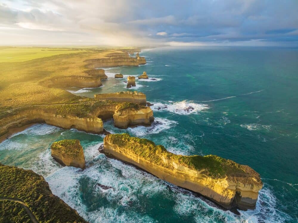 Aerial view of the Island Archway and Razorback at sunrise. Great Ocean Road Victoria Australia