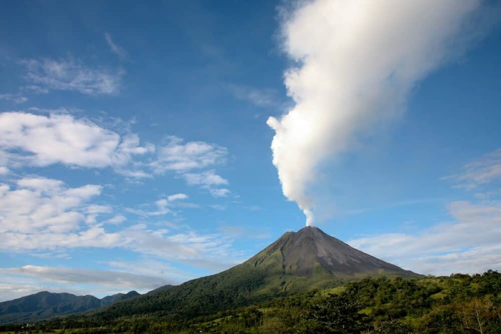 Arenal volcano in costa rica with a plume of smoke