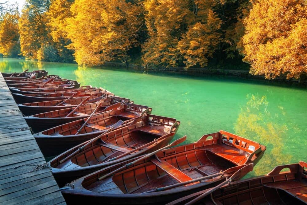Boats parking at pier with turquoise lake landscape of Plitvice Lakes National Park, UNESCO heritage, famous travel destination of Croatia. The lakes are located in central Croatia