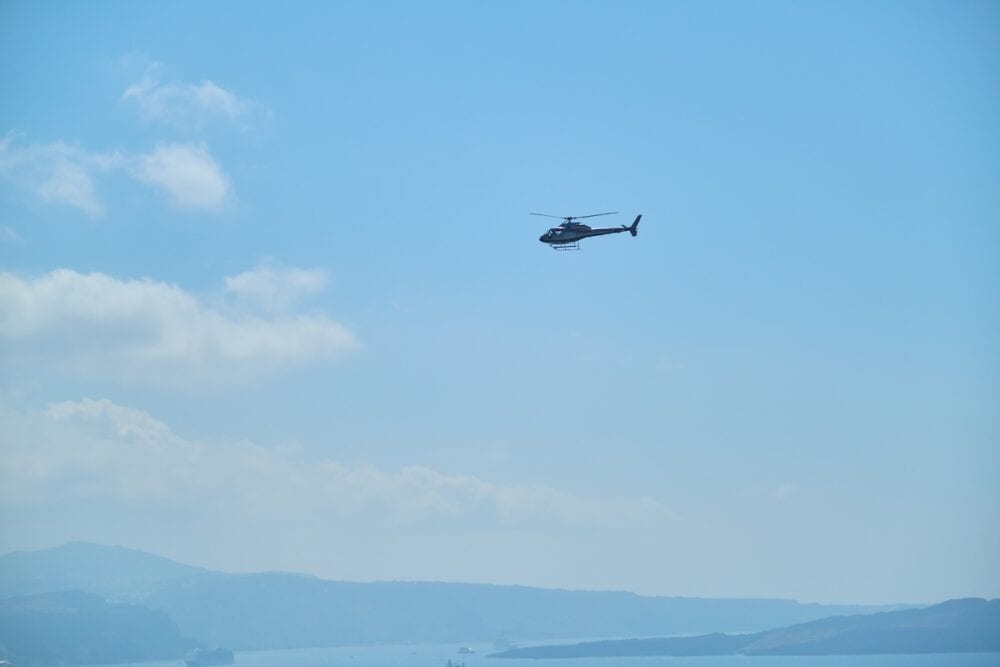 Greece, Santorini. Helicopter in the sky over the Greek island of Santorini.
