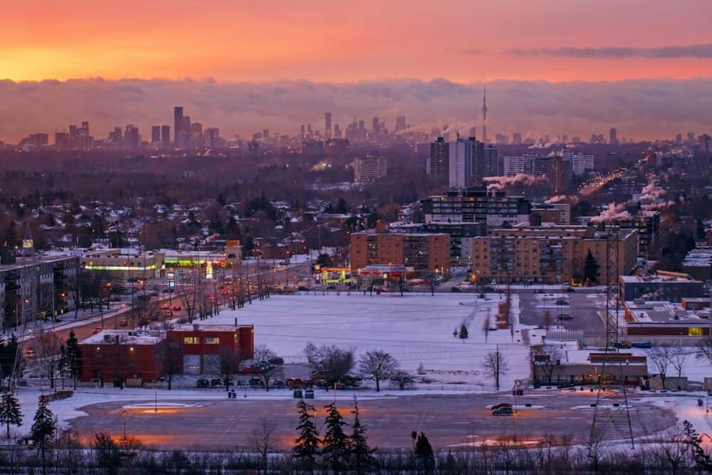 Toronto, Ontario, Canada - Aerial top view of morning winter landscape in Toronto city, Canada. Canadian urban downtown or residential area at sunrise.